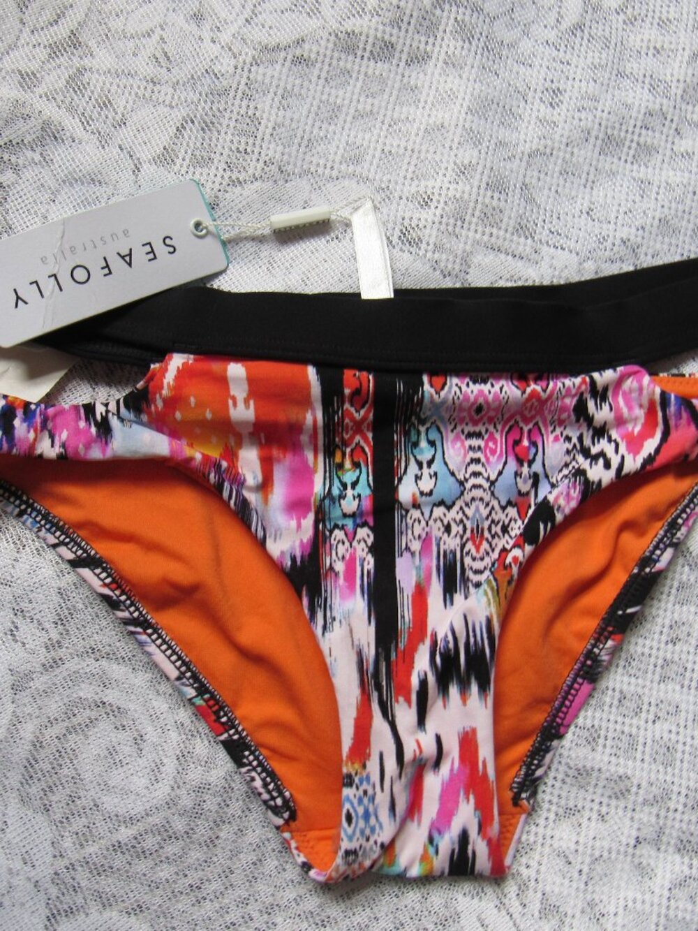 Seafolly Women Swim bottom. size S(6 Can), orange /black
